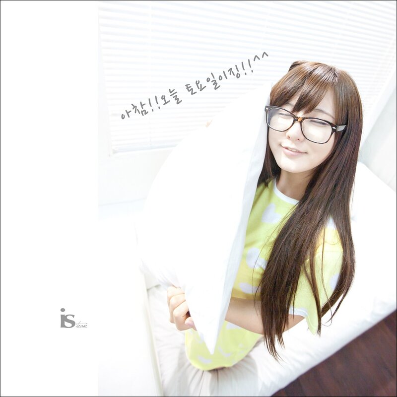 woman in glasses holding pillow