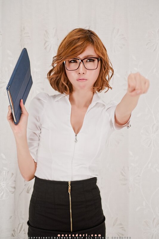 woman in glasses holding tablet
