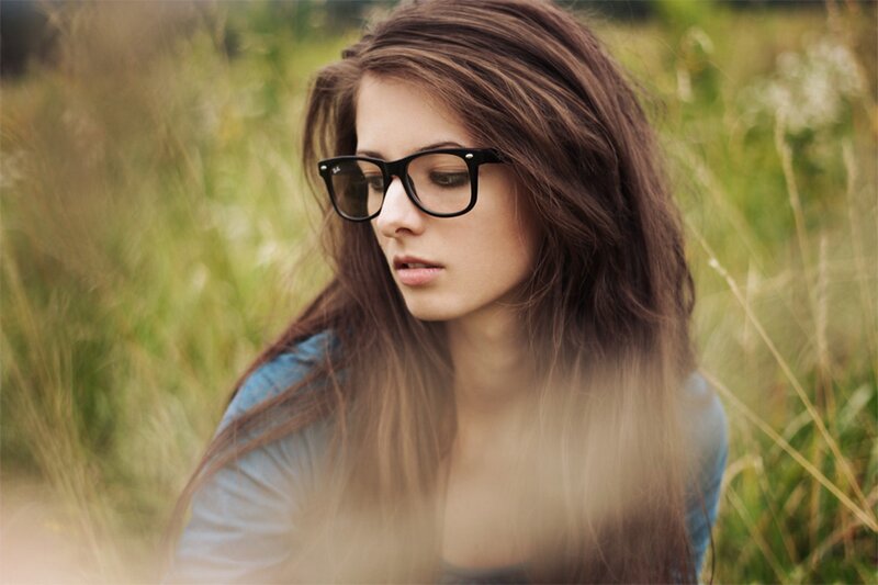 woman in glasses in a field