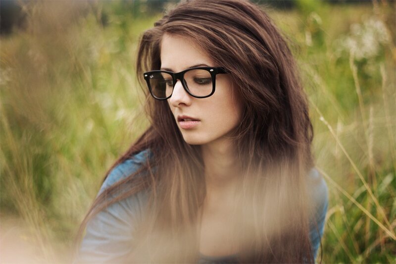 woman in glasses in a field