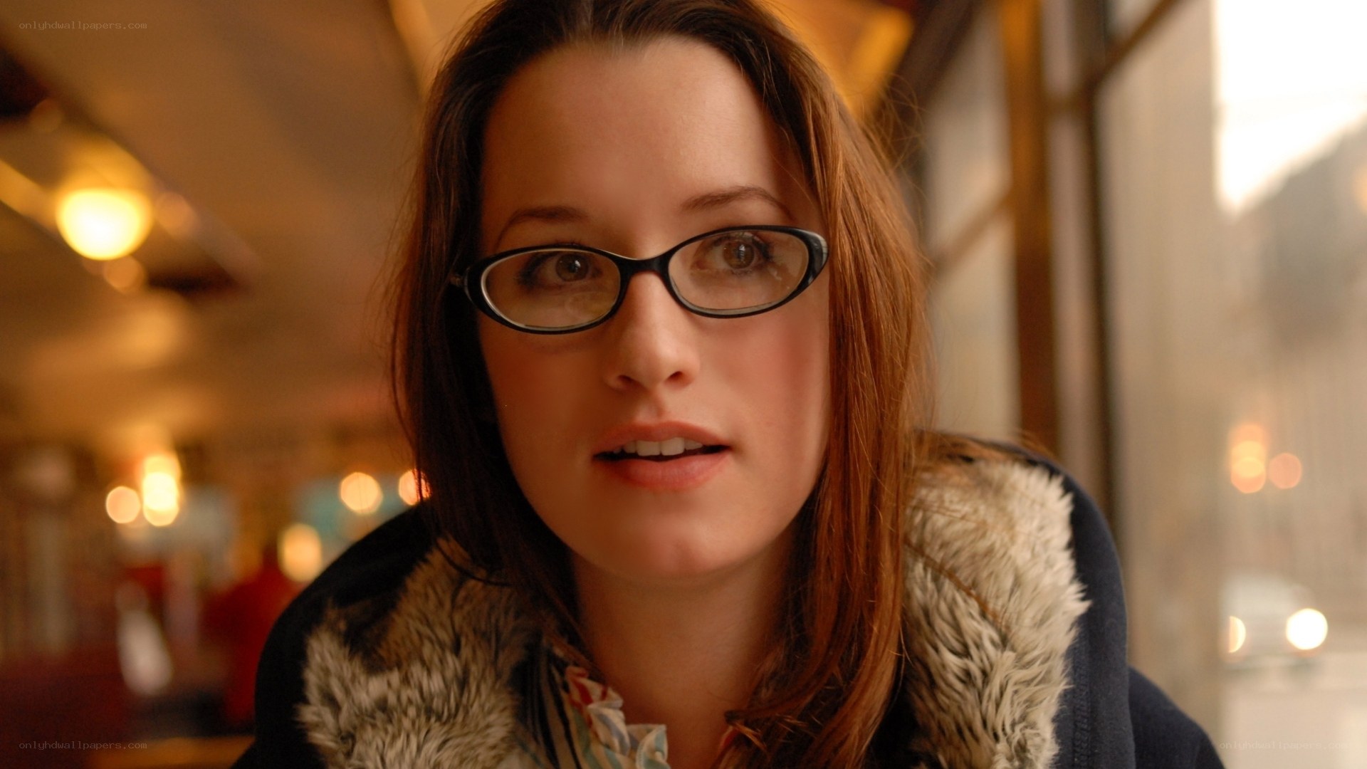 woman in glasses looking at camera