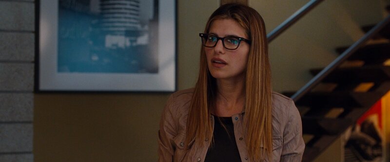 woman in glasses looking concerned