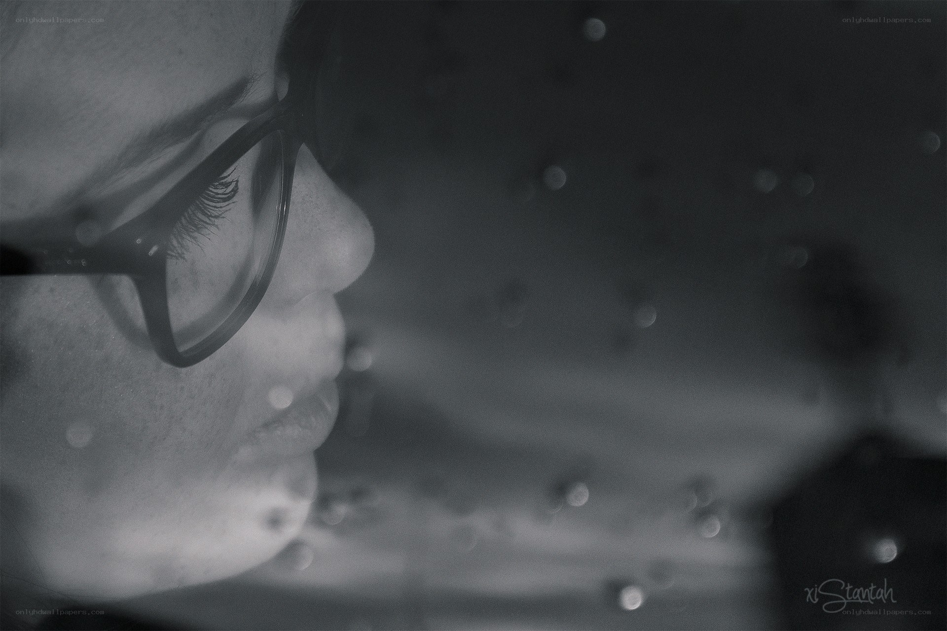woman in glasses looking down
