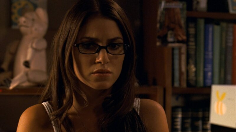 woman in glasses looking serious