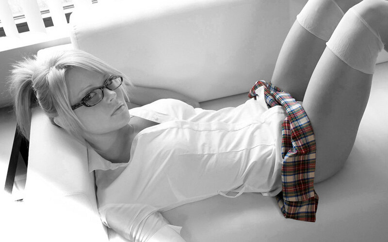 woman in glasses lying on couch