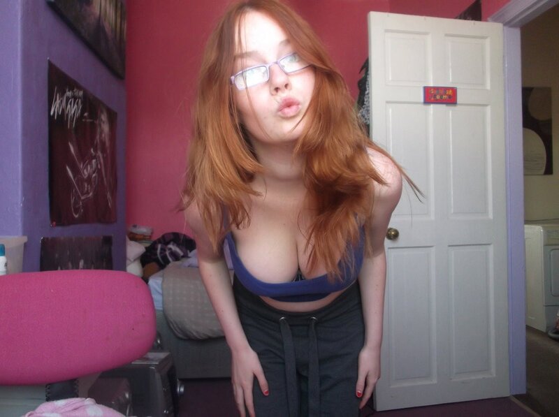 woman in glasses making a face
