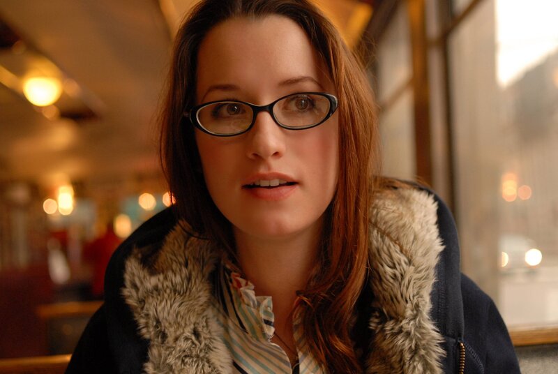 woman in glasses on a bus