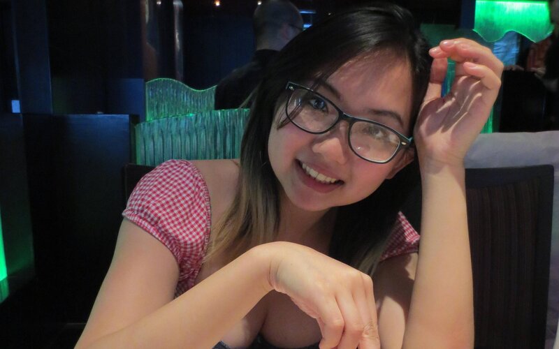 woman in glasses smiling