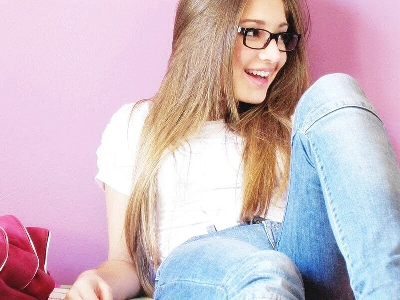 woman in glasses smiling