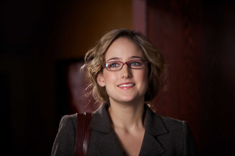 woman in glasses smiling