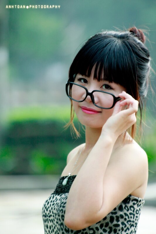woman in glasses smiling
