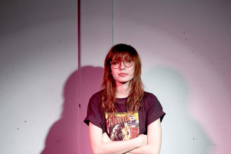 woman in glasses with arms crossed