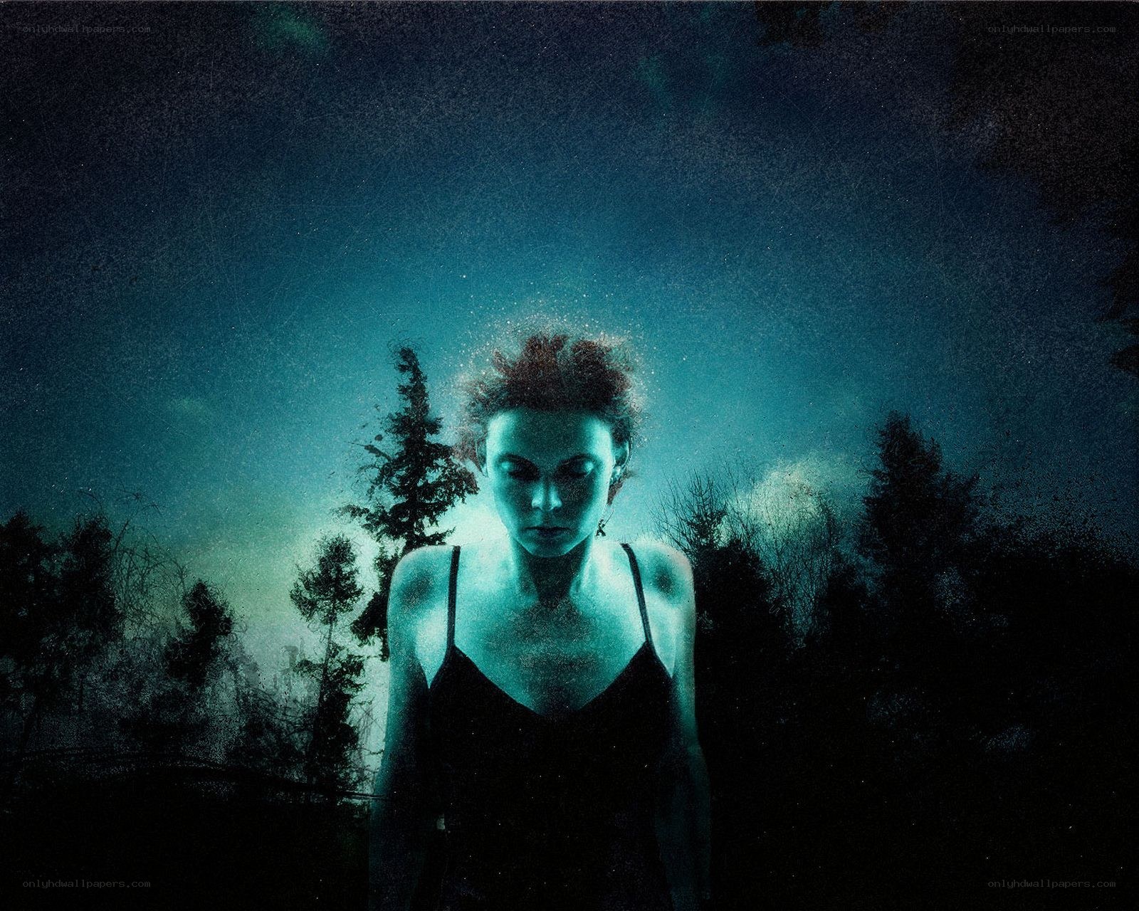 woman in glowing forest