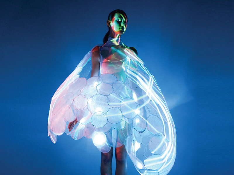 woman in glowing light dress