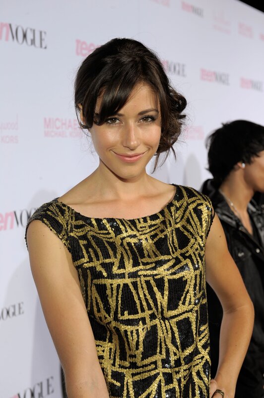 woman in gold and black dress