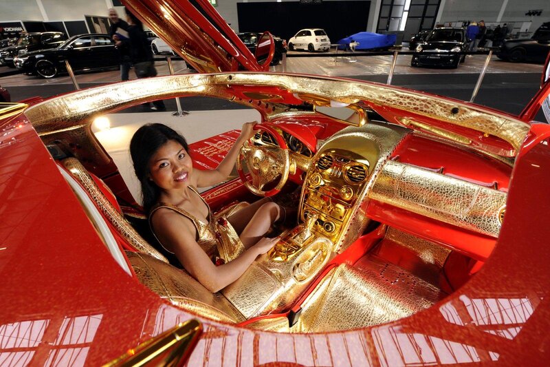 Woman in Gold Car