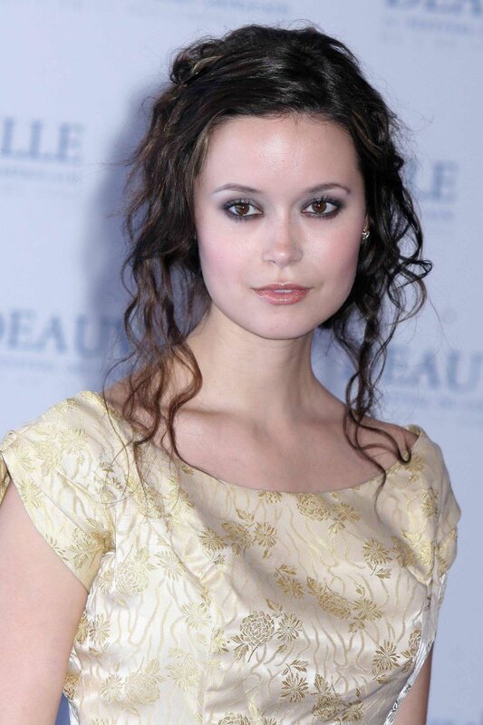 woman in gold dress at event