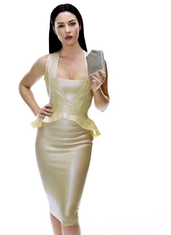 woman in gold dress holding clutch