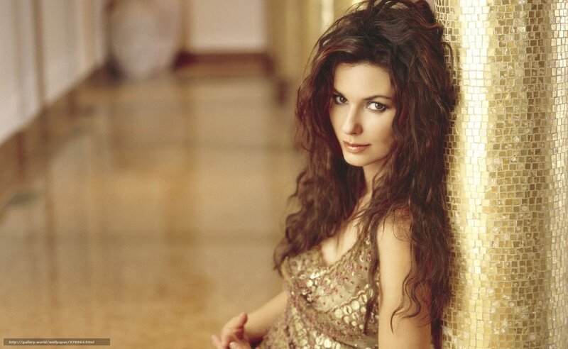 woman in gold dress leaning