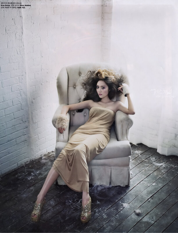 woman in gold dress on chair