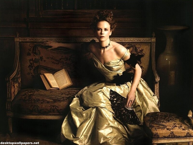 woman in gold dress on sofa