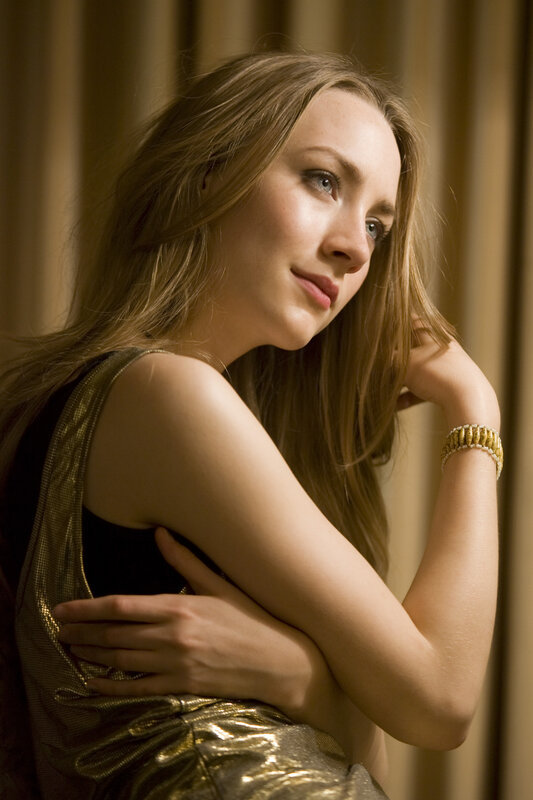 woman in gold dress posing