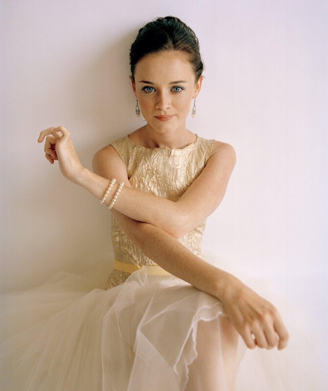 woman in gold dress posing