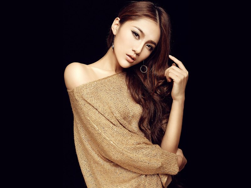 woman in gold knit sweater