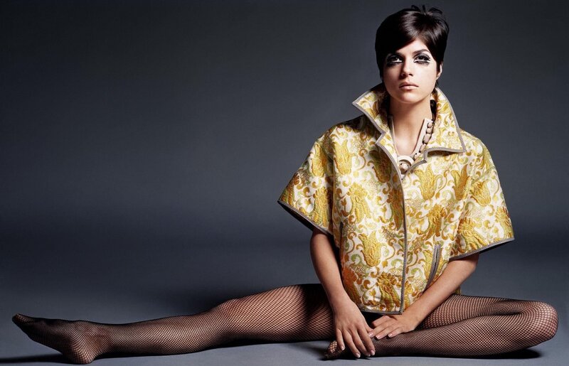 woman in gold patterned jacket