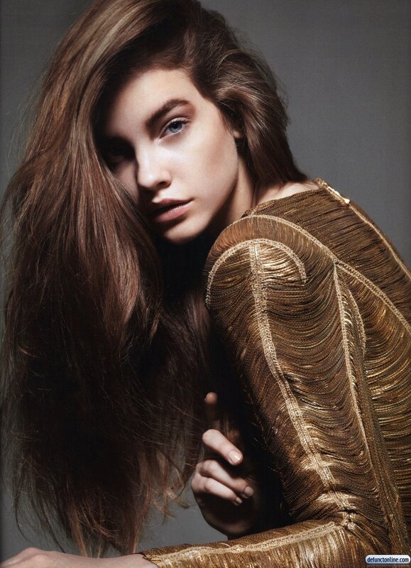 woman in gold textured top