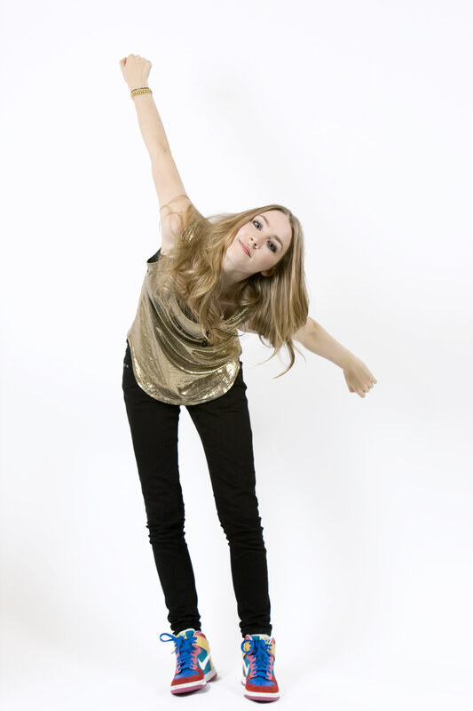woman in gold top dancing