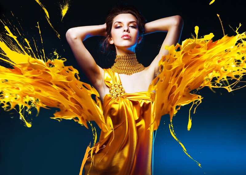 woman in golden dress with paint splashes