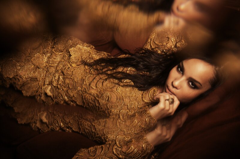 woman in golden lace dress