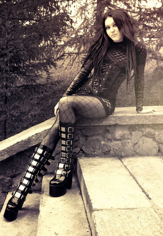 woman in gothic attire sitting