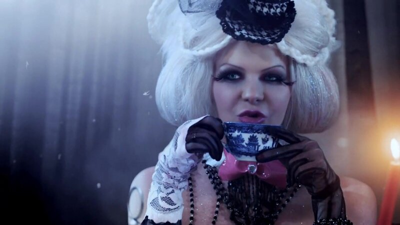 woman in gothic costume drinking tea