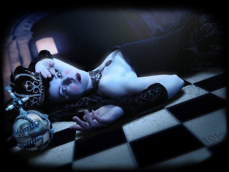 woman in gothic costume lying on floor