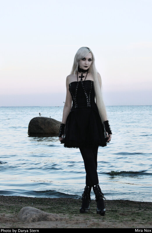 woman in gothic dress at beach