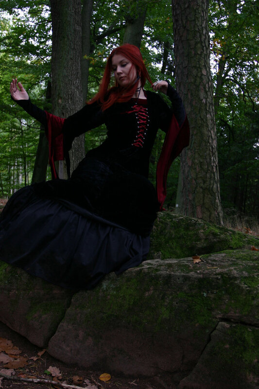 Woman in gothic dress in forest