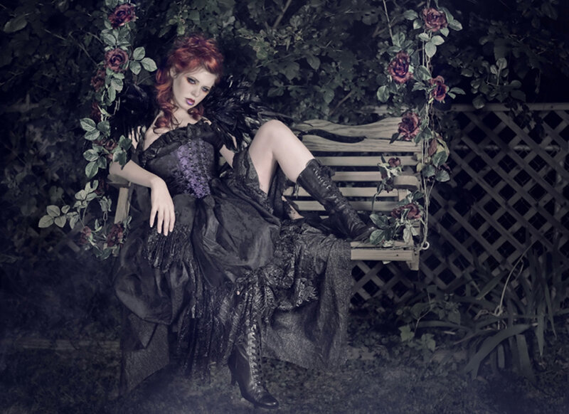 Woman in gothic dress on bench