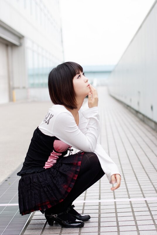 woman in gothic outfit crouching