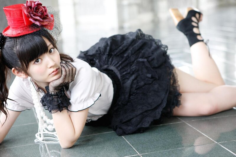 woman in gothic outfit lying on floor