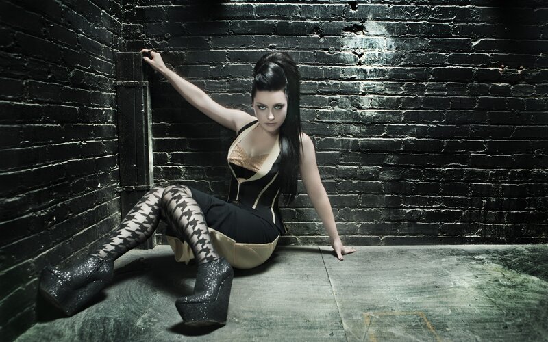 woman in gothic outfit sitting
