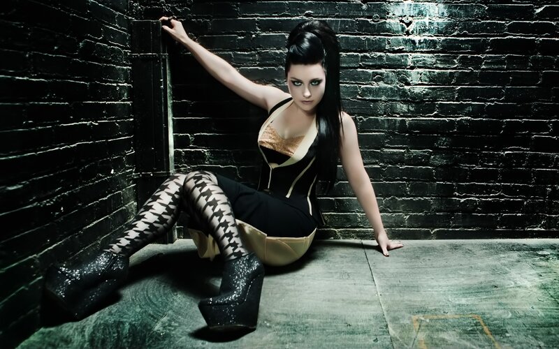 woman in gothic outfit sitting