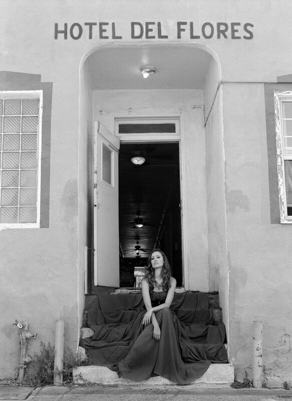Woman in gown at hotel entrance