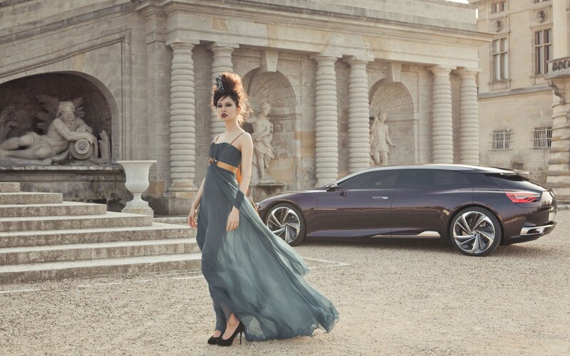 Woman in gown with concept car