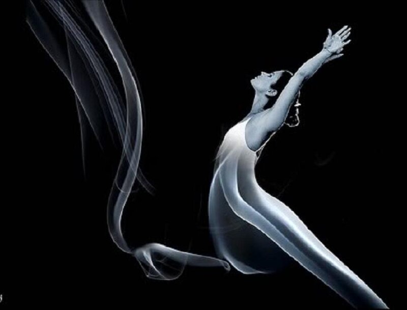 woman in graceful pose with smoke