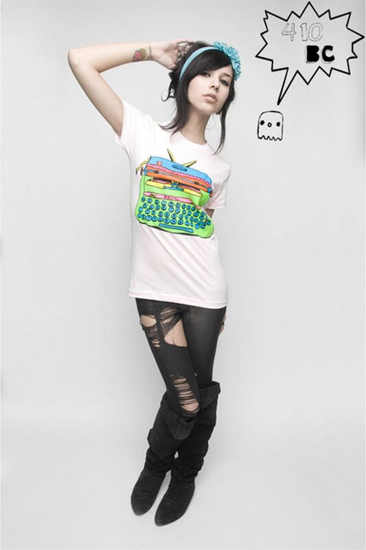 woman in graphic t-shirt and ripped pants