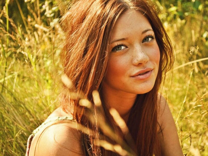 Woman in Grass Field — Brown