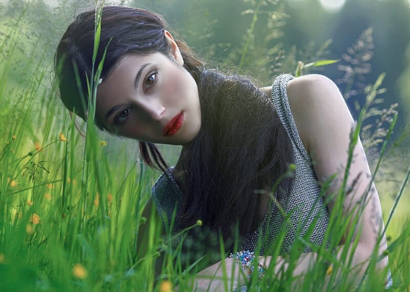 Woman in Grass Field — Green, Serene, Afternoon, Photograph, Flowers