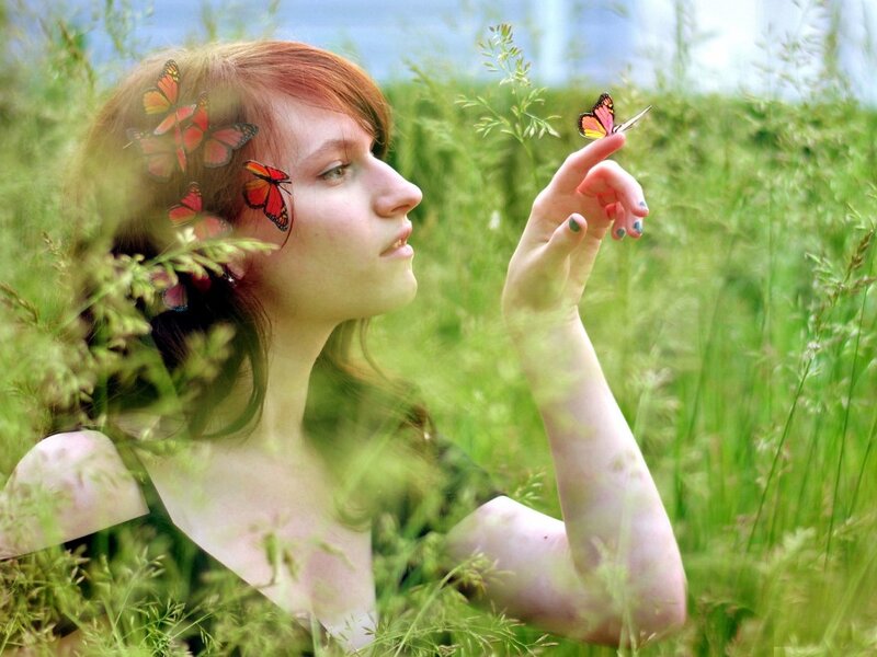 Woman in Grass with Butterflies
